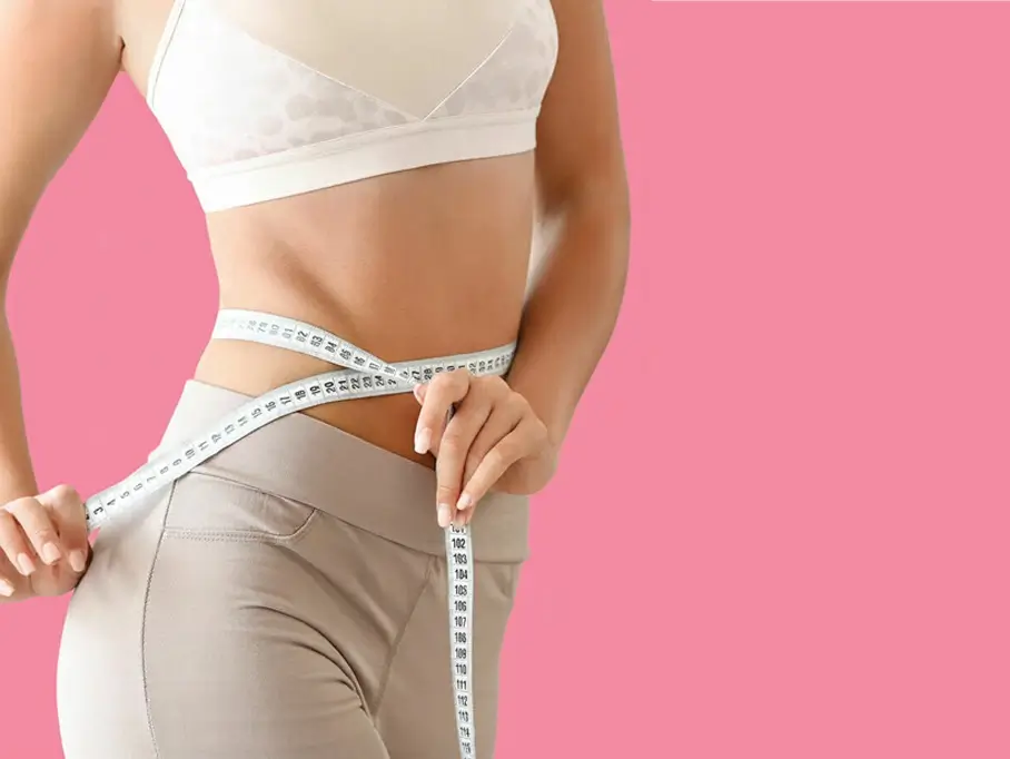 A client result with measuring tape after our weight loss injections program